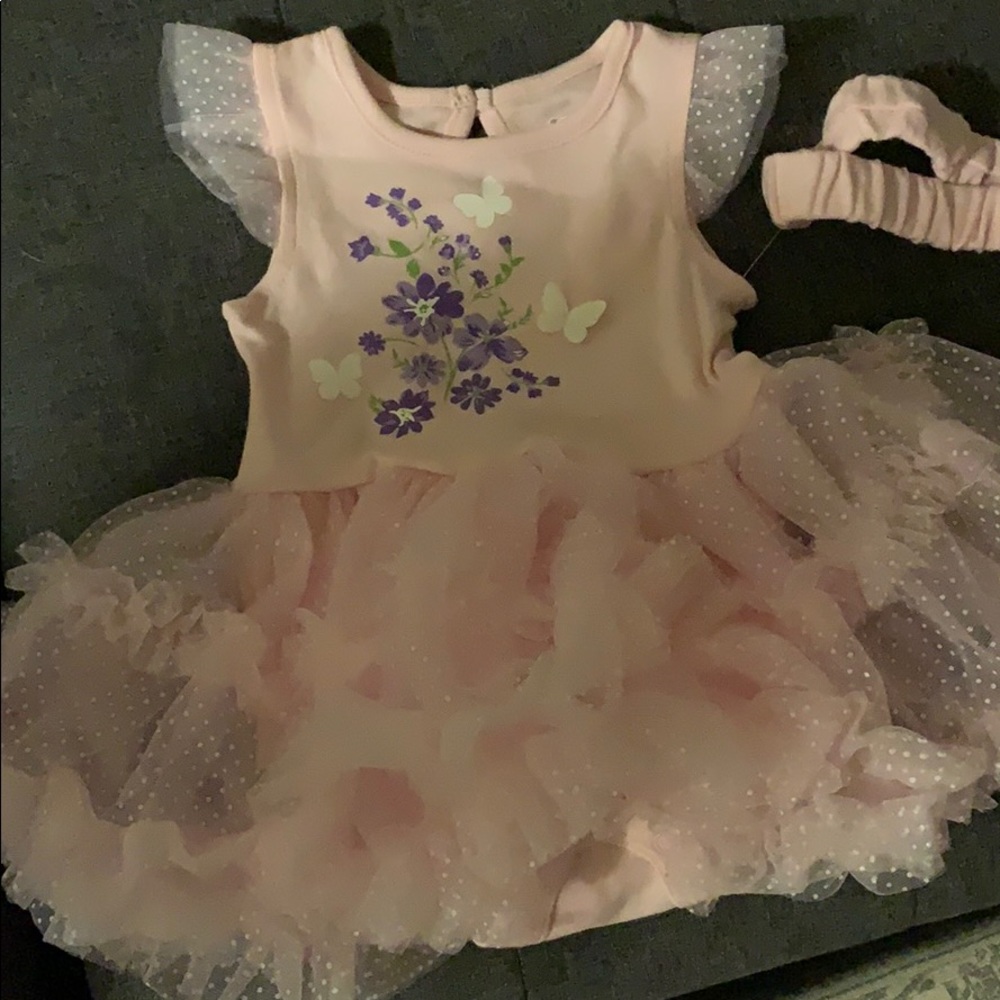 Brand new baby girl dress with matching headband.